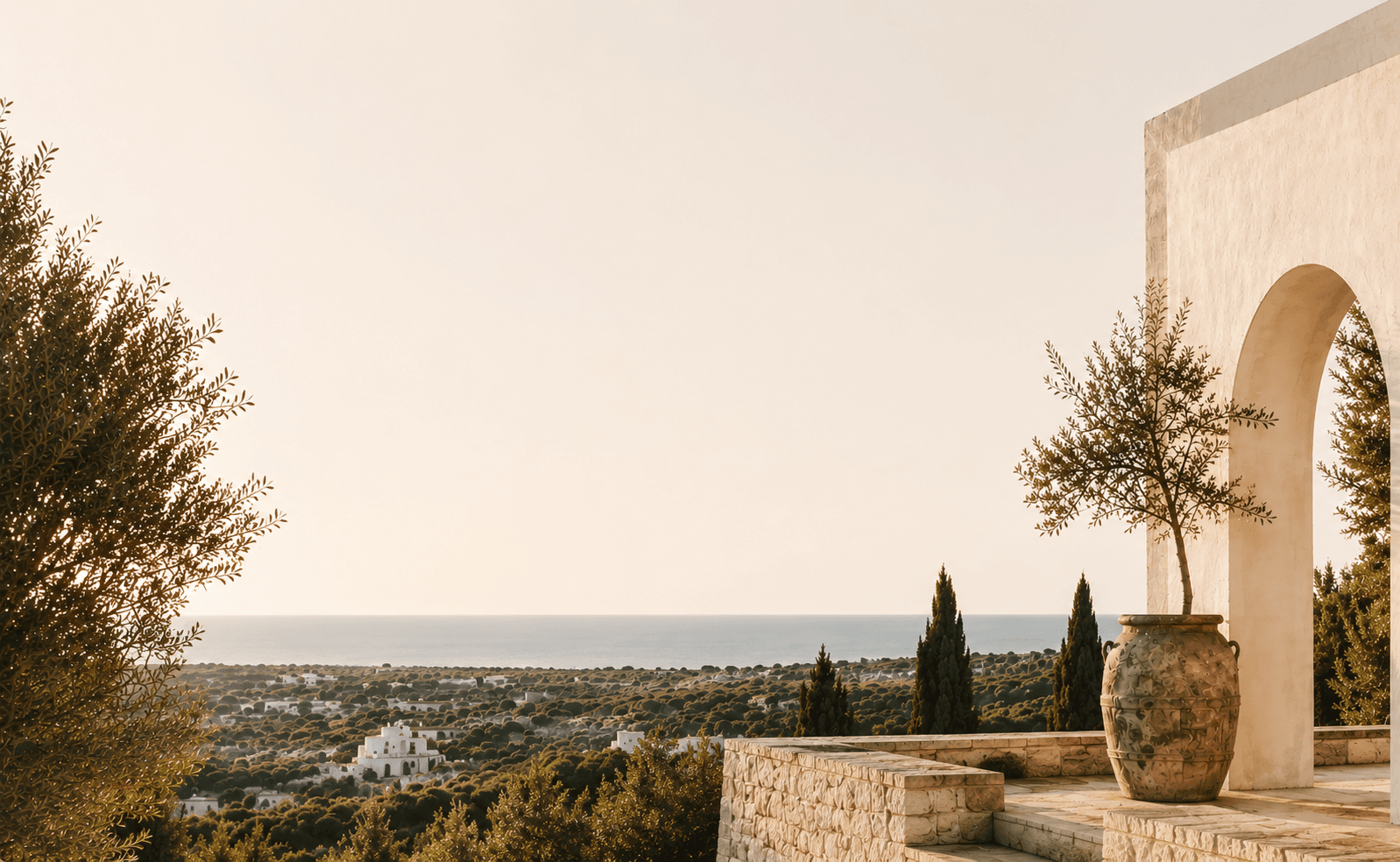 A sunlit Puglian landscape overlooking the Italian coast